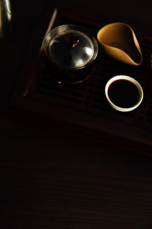 tea ceremony, tea brewing on a brown tea board, dark abstract tea backgroundの写真素材