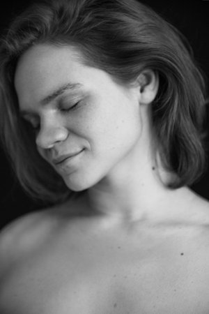 details of body black and white portrait of beautiful girl, fuzzy and blurry art photography