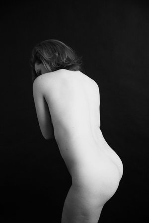 details of body black and white portrait of beautiful girl, fuzzy and blurry art photography