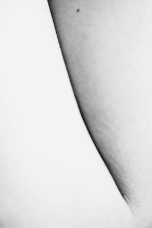 lines and creases on the female body, the geometry of body parts, fuzzy and blurred art photographyの写真素材