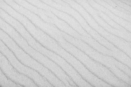 sandy beach, macro sand texture, black and white backgroundの写真素材