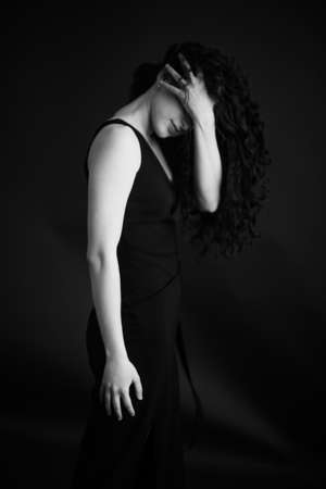 A dramatic and dark portrait of a brunette.の写真素材