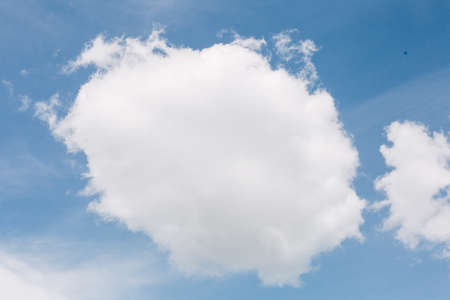 beautiful blue summer sky with delicate clouds, a place for textの写真素材