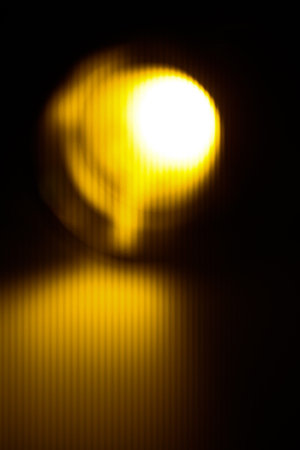 abstract orange blurred background, glare and light, bokeh and soft focusの写真素材