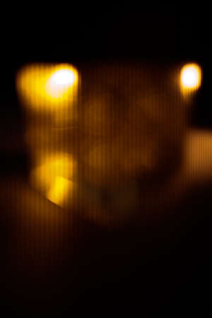 abstract orange blurred background, glare and light, bokeh and soft focusの写真素材