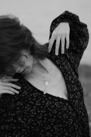 black and white fuzzy film portrait of a young girl, blurry and blurry photo of a womanの写真素材