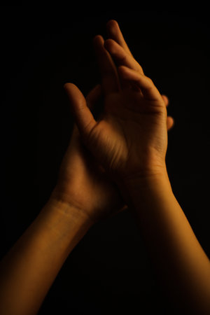 beautiful hand art photo, creative vision of human hands, magic and texture overlay. a fuzzy frame of body details, defocused close-up imageの写真素材