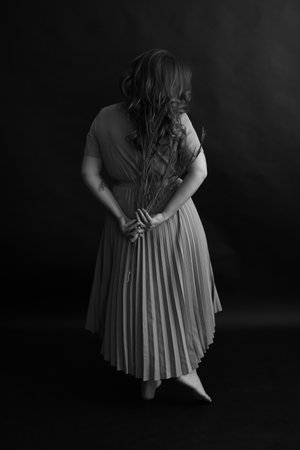 details of the female body and dried flowers, plants and flowersの写真素材