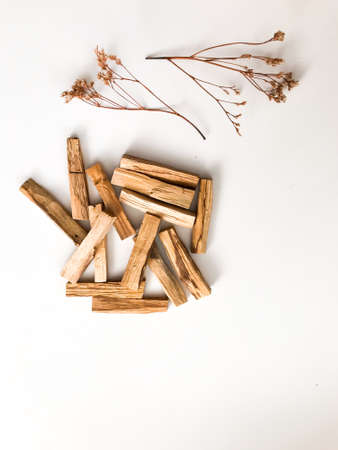 A set of wooden sticks Palo Santo on a white background. Aromatherapy and religious rites and meditations. Organic holy tree incense from Latin America top viewの写真素材