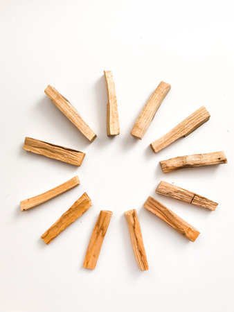A set of wooden sticks Palo Santo on a white background. Aromatherapy and religious rites and meditations. Organic holy tree incense from Latin America top viewの写真素材
