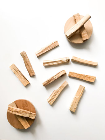 a very beautiful background of wooden palo santo sticks, aromatherapy and the magic of aromas on a...
