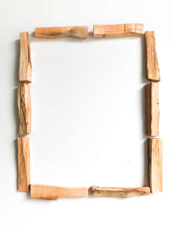 a very beautiful background of wooden palo santo sticks, aromatherapy and the magic of aromas on a white background. Light image blurring, lack of focus, soft texture combinations.の写真素材