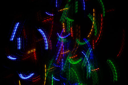 Moving neon multicolored lights abstract texture. long exposure shot