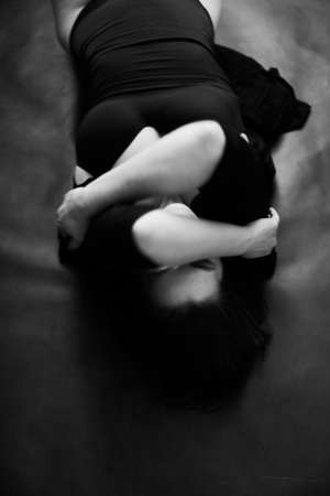 Close-up of women's hands. A black and white frame with a slight blur and defocus on the image. Details of body, fashion and artの写真素材