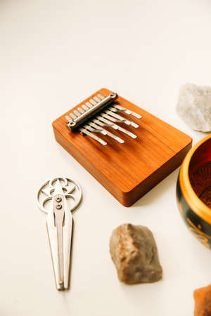 Ethnic shamanic musical instruments, singing bowl, harp and kalimbaの写真素材
