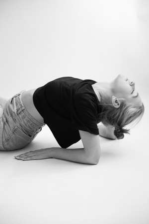 The girl does stretching and exercisesの写真素材