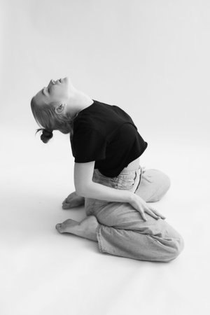 The girl does stretching and exercises