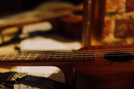 Acoustic guitar on the table in the music studio. Selective focus.