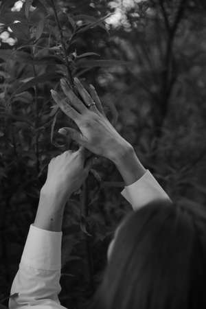 Delicate female hand close-up, beautiful body details out of focusの写真素材
