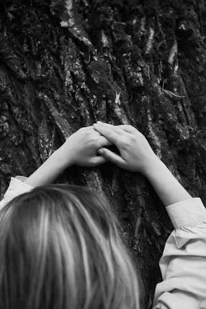 Delicate female hand close-up, beautiful body details out of focusの写真素材