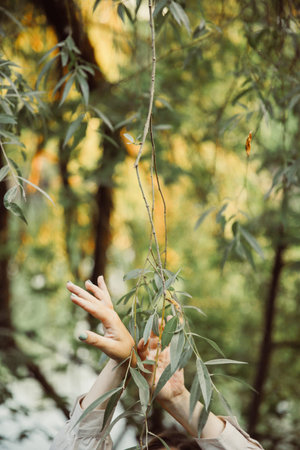 Delicate female hand close-up, beautiful body details out of focusの写真素材