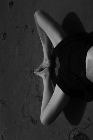 Body details, women's legs close-up, the beauty of the female body. Frame with soft focus and the effect of film vintage photographyの写真素材