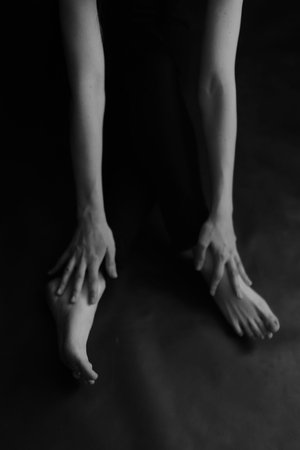 Delicate female hand close-up, beautiful body details out of focus