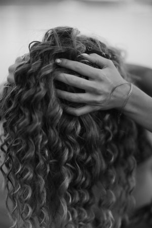 Delicate female hand close-up, beautiful body details out of focusの写真素材