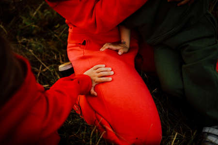 Delicate female hand close-up, beautiful body details out of focusの写真素材