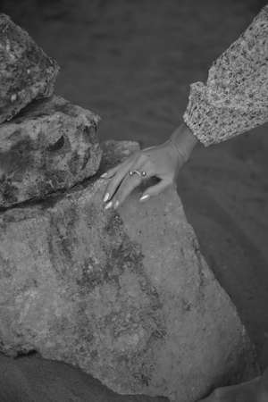 Delicate female hand close-up, beautiful body details out of focusの写真素材