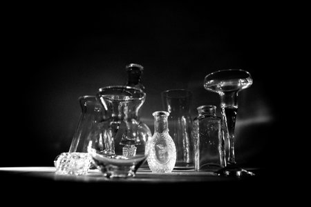 Laboratory glassware. Science laboratory research and development concept. Laboratory glassware on dark toned foggy background. Selective focusの写真素材