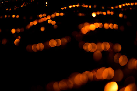Abstract bokeh background of lights on black background.の写真素材