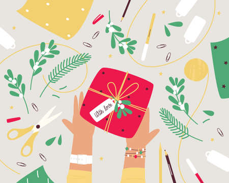 Christmas gift wrapping on the table, top view. Preparing to celebrate Christmas or New Year. Top view table with scissors, decoration and tree branches. Flat vector illustrationのイラスト素材