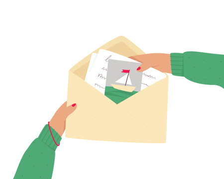 An open envelope in hands with a letter and a postcard on a white background. Hands hold an envelope...