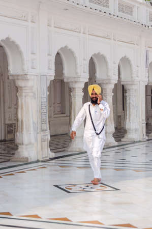 Amritsar, India - November 21, 2011: The Sikh pilgrim in the Golden Temple complex. Amritsar, Punjab, India.のeditorial素材