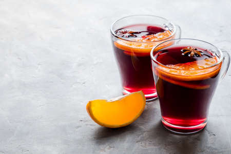 Two glasses of mulled wine on a gray background with copy space.の写真素材