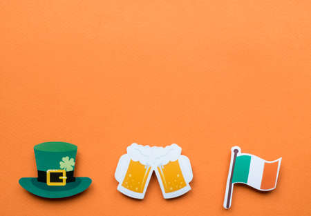 St Patricks Day symbols on orange background with copy space.の写真素材
