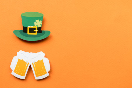 St Patricks Day symbols on orange background with copy space.