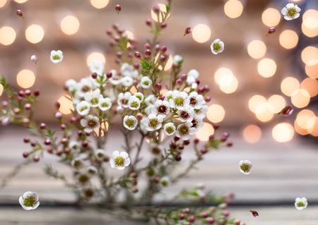 Small wax flowers with bokeh wooden backgroundの写真素材