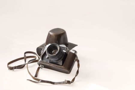 Vintage photo camera with leather brown case, isolated on white backbackgroundの写真素材
