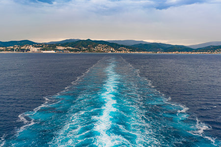 Trail on sea surface from cruise ship off the coast of Savonaの写真素材