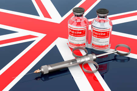 Vaccination in the United Kingdom concept. Vaccine bottles with syringe on the British flag, 3D rendering isolated on white backgrounの写真素材