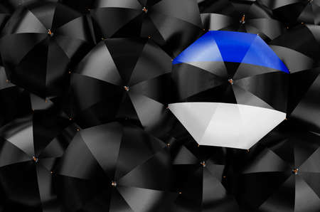 Umbrella with Estonian flag among black umbrellas, top view. 3D renderingの写真素材
