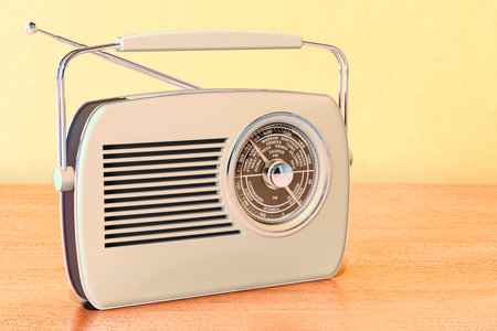 Vintage radio receiver on the wooden table. 3D renderingの写真素材