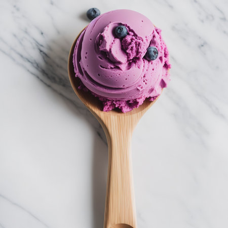Blueberry ice cream scoop isolated on white backgroundの素材