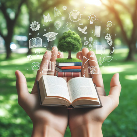 Read and knowledge concept, hand holding book on soft green park banner backgroundの素材