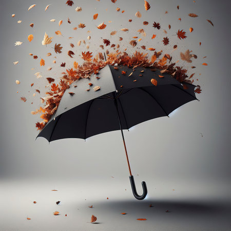 black umbrella with dry leaves falling from inside on grey backgroundの素材