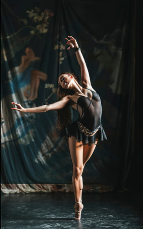 Young beautiful female dancer in a black bathingの素材