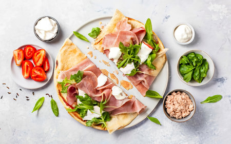 Italian street food flat lay with piadina isolated on a white backgroundの素材