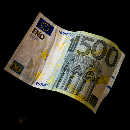 one hundred euro banknote behind wave carved on a black backgroundの素材